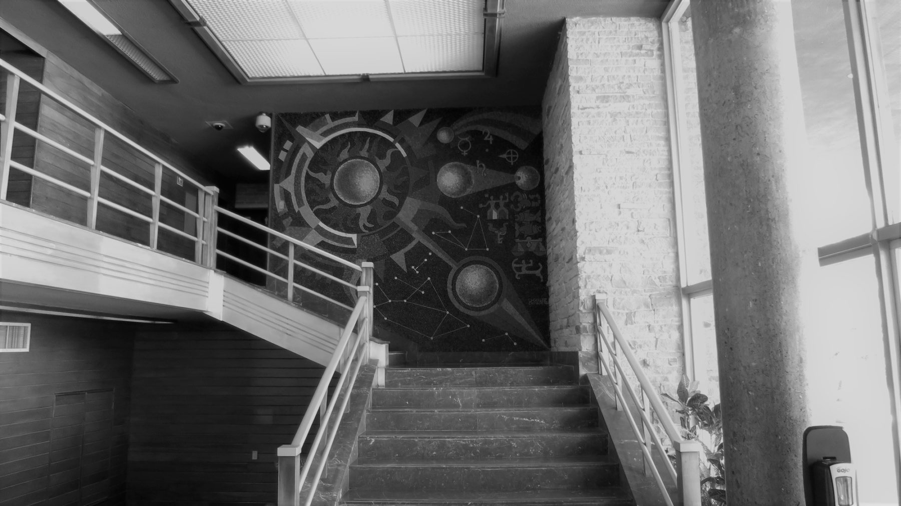 black and white photo of the before condition of the building entry